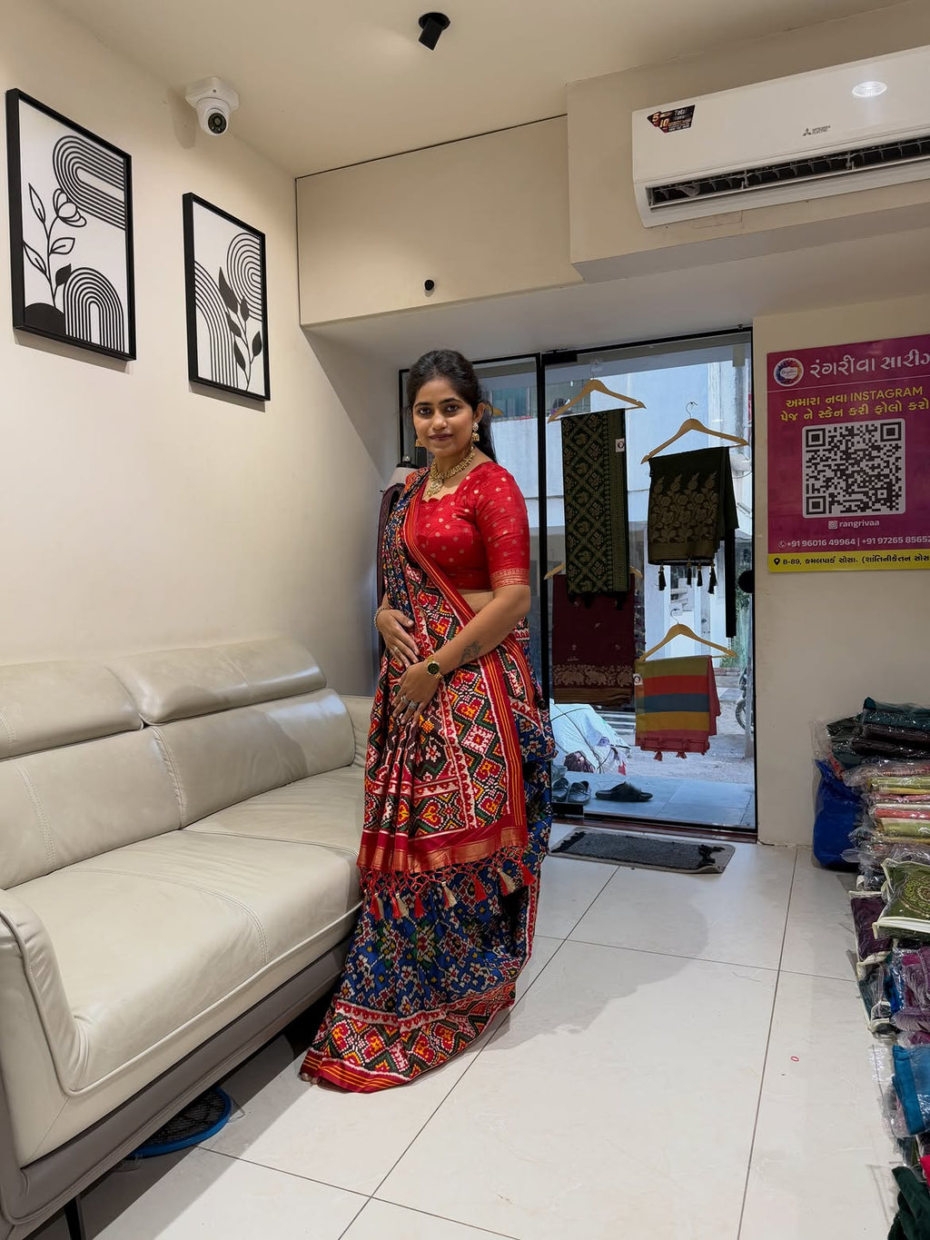 Navy blue silk saree with red patterned border side view
